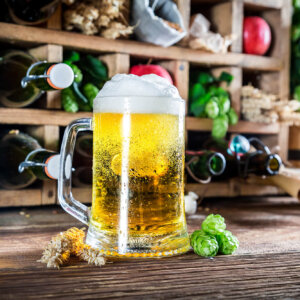 Fresh apple beer and ingredients in wooden box