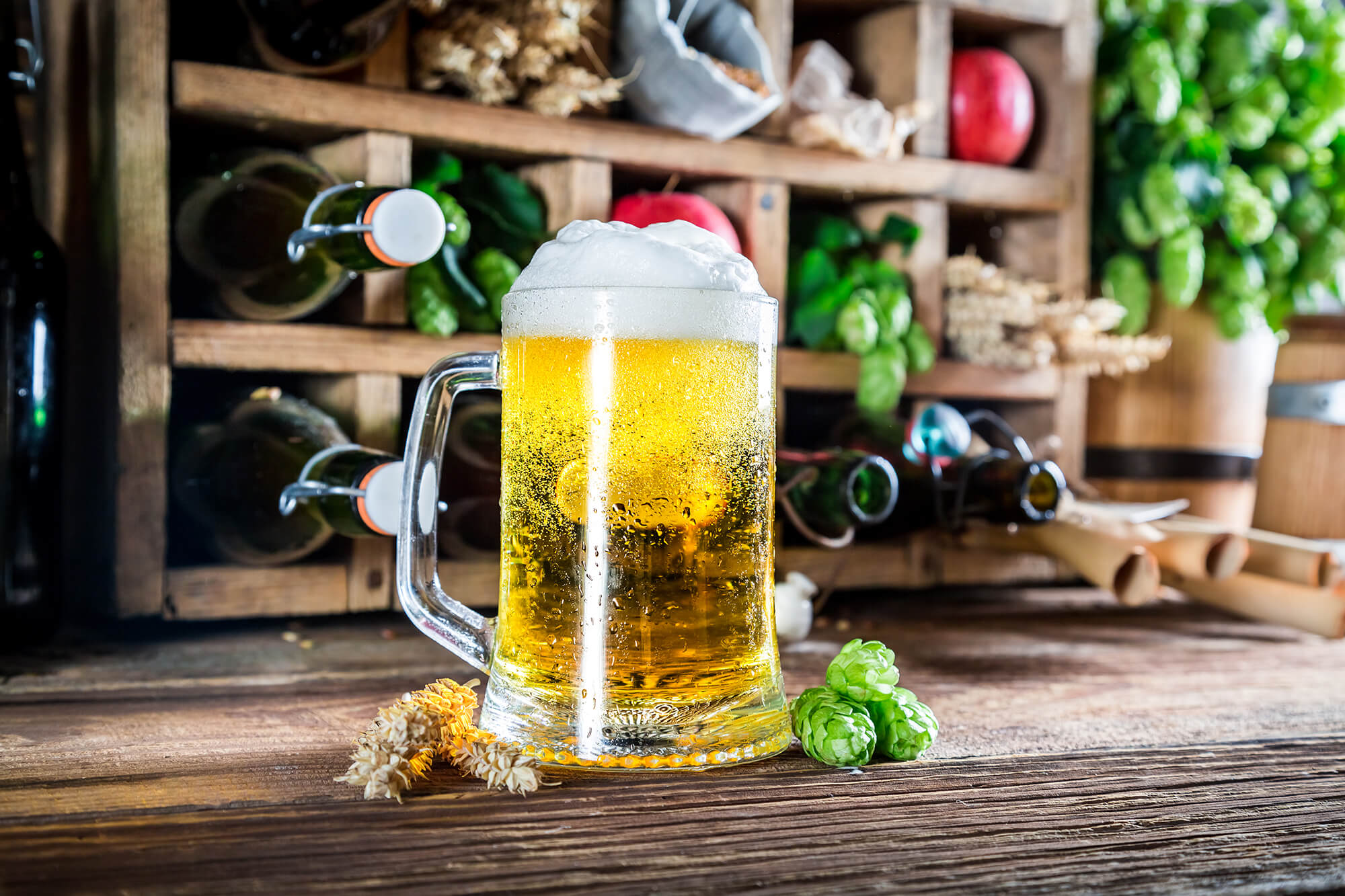 Fresh apple beer and ingredients in wooden box